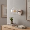 Applique da parete moderna Gastor con sfera in vetro chiaro e portalampada E14